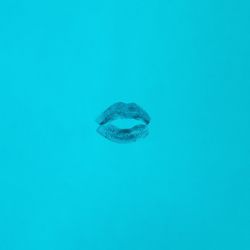 Lipstick mark on blue background
