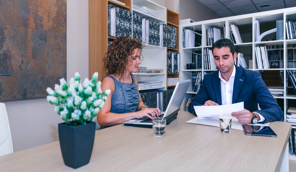Businesspeople working together at table in office