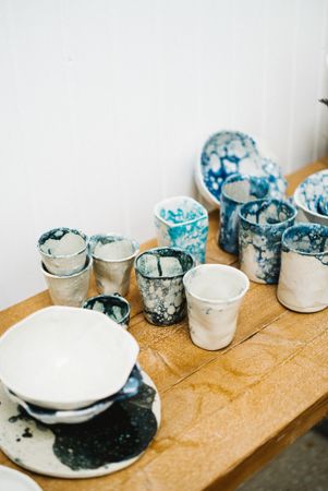 Mugs and plates in ceramics shop