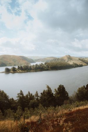 Majestic view of lake surrounded by hills