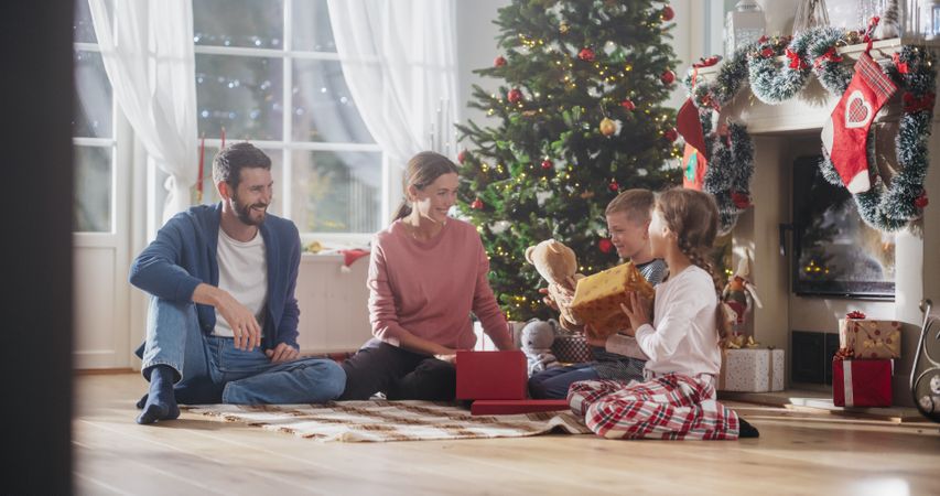 Happy Children Getting New Toys from Mom and Dad