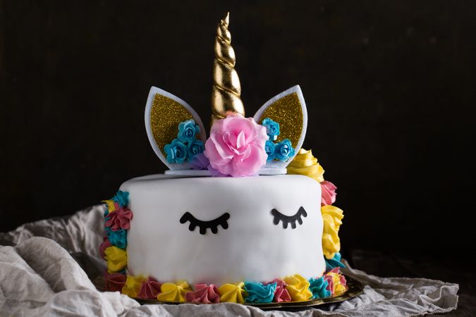 Cute unicorn cake with painted closed eyes