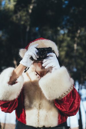 Happy Santa Claus with camera