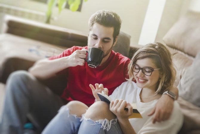 Couple sitting at couch together
