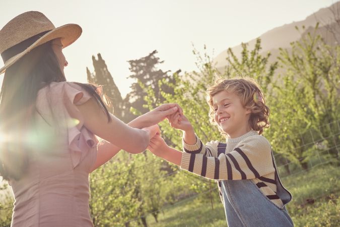 Happy woman with son in summer day