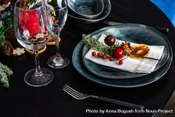 Holiday table setting with decorative berries and dried orange slice 5wZRZ0