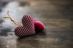 Valentine's day concept of thatched heart decorations on wooden table