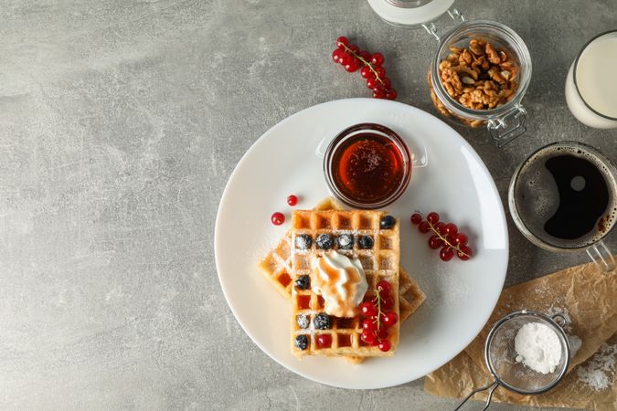 Composition of breakfast with belgian waffles, top view