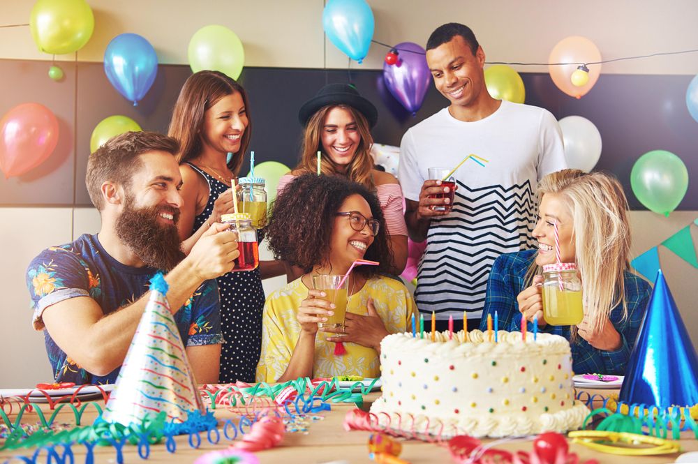 Multi ethnic group of friends at a birthday party