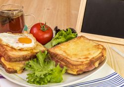 Breakfast and chalkboard  on wooden table