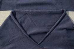 Collar dark grey knitted fabric background texture.