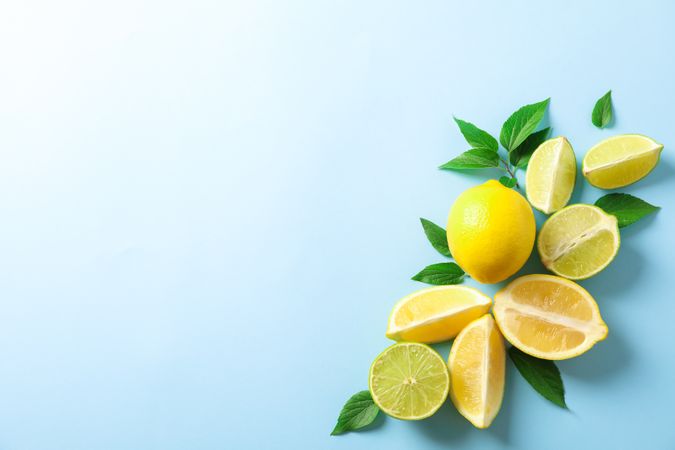Flat lay composition with citrus on color background, space for text