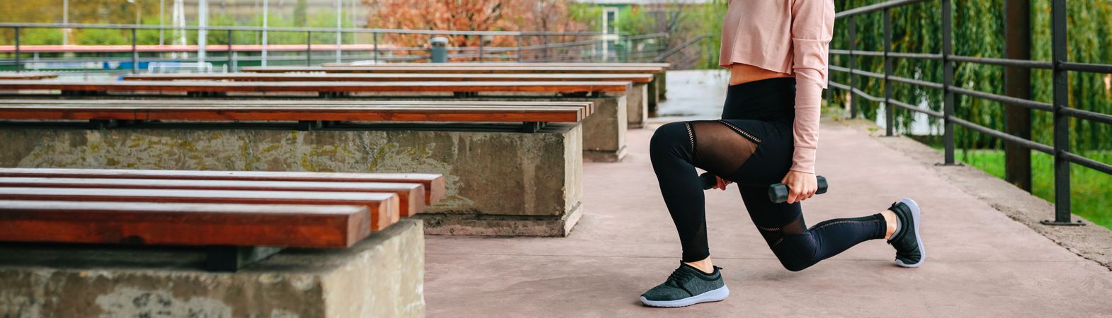 Young woman training with dumbbells