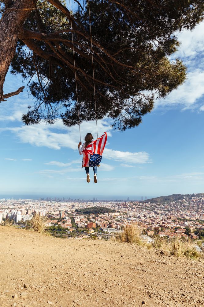 Woman with flag on swing