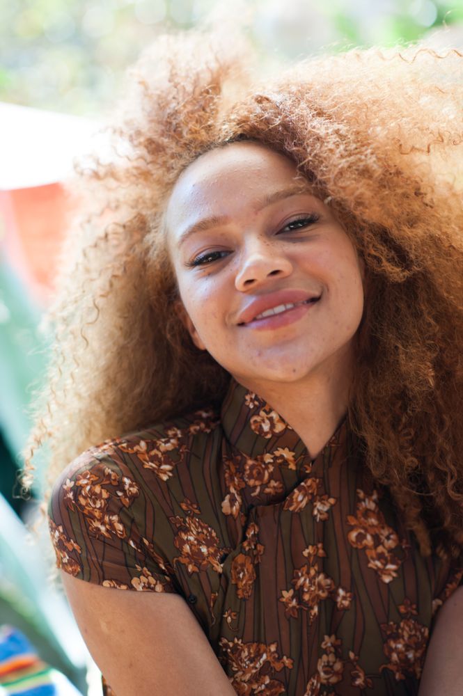 Close up portrait of young woman smiling at camera