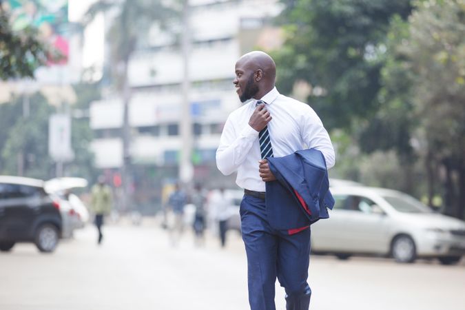 Man in suit walking on street