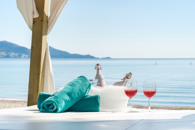 Wine and towels on beach