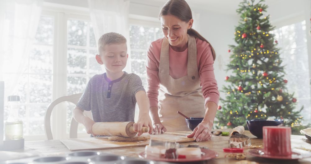 Portrait of Woman and her Son Baking Together During Christmas.