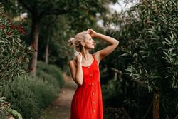 Dreamy young woman in summer garden