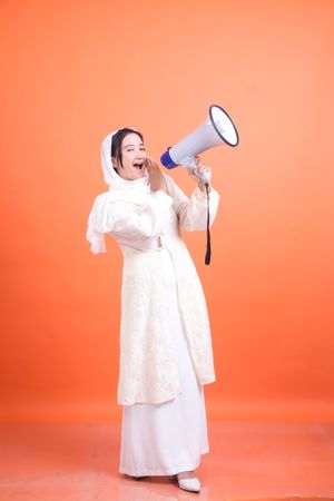 Empowered voice, Woman using megaphone, embodying influence