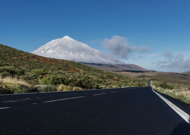 Countryside road near snowy mountain peak