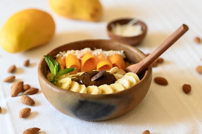 Bowl with appetizing fruits and nuts