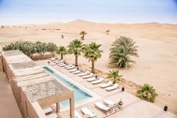 Poolside of exotic hotel in desert