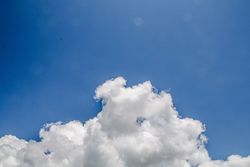 Fluffy clouds in blue sky