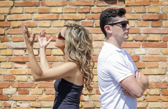 Couple in a quarrel and the woman up her hands