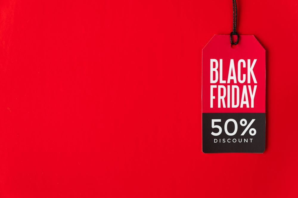 Sales tag on red background with copy space