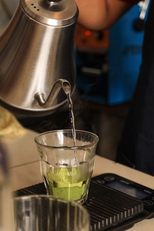 Pour Hot Water to the Glass with Green Tea Matcha Powder