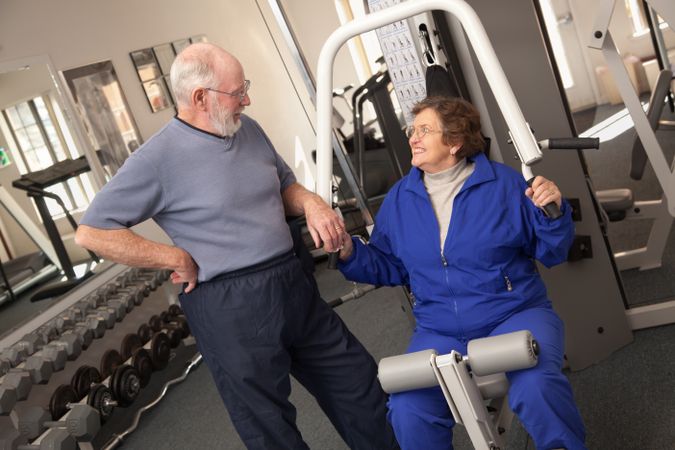 Mature Adult Couple Working Out Together in the Gym