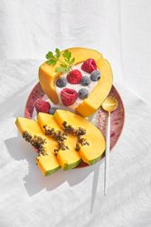 Delicious papaya bowl with berries and yogurt