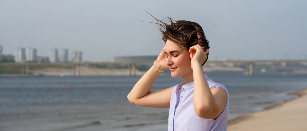 Woman listening to music in headphones outdoors