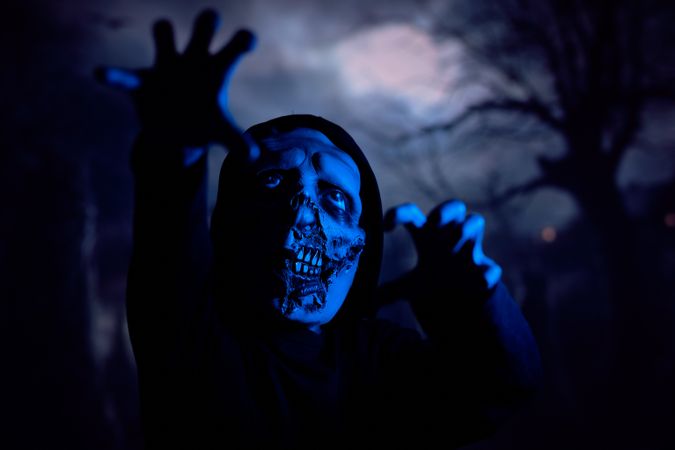 Scary zombie under blue neon light