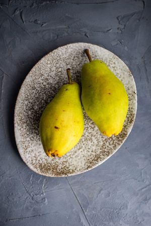 Top view of pears in grey plate