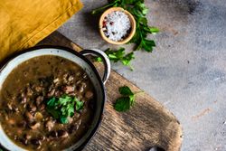 Top view of delicious bean soup with parsley