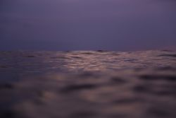 Water wave and cloudy sky