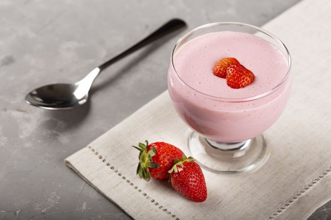 Delicious strawberry mousse in glass goblet.
