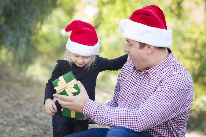 Father Giving Young Daughter Christmas Gift