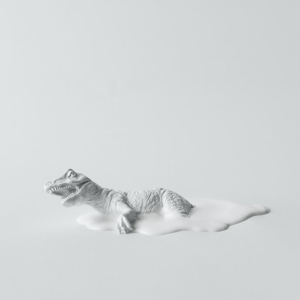 Painted dinosaur on light background