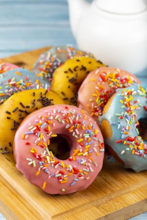 Delicious assorted colorful donuts on the table.
