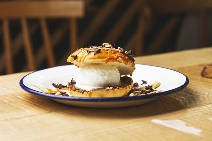 Tasty sweet burger with chocolate crumb and nuts