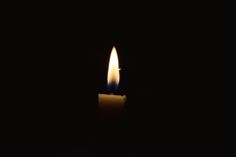 Candle burning in the dark