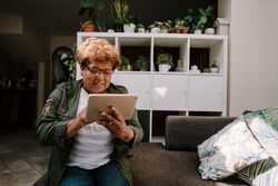 Older Black woman using tablet