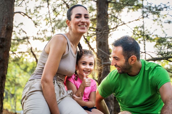 Happy Family Bonding in Nature - Smiling Parents and Child Portrait
