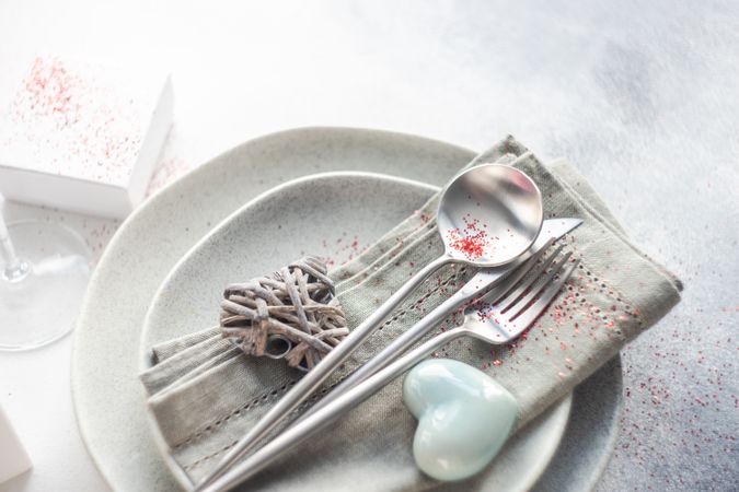 Grey themed table setting for Valentine's day with ceramic heart