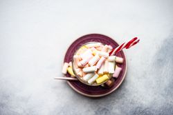 Top view of marshmallow hot chocolate with candy cane