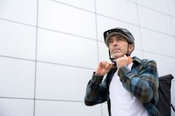 Serious man in stylish clothes on street