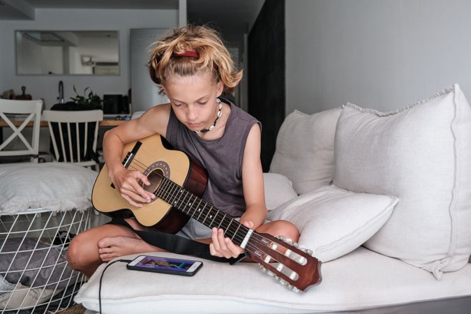 Child playing the guitar